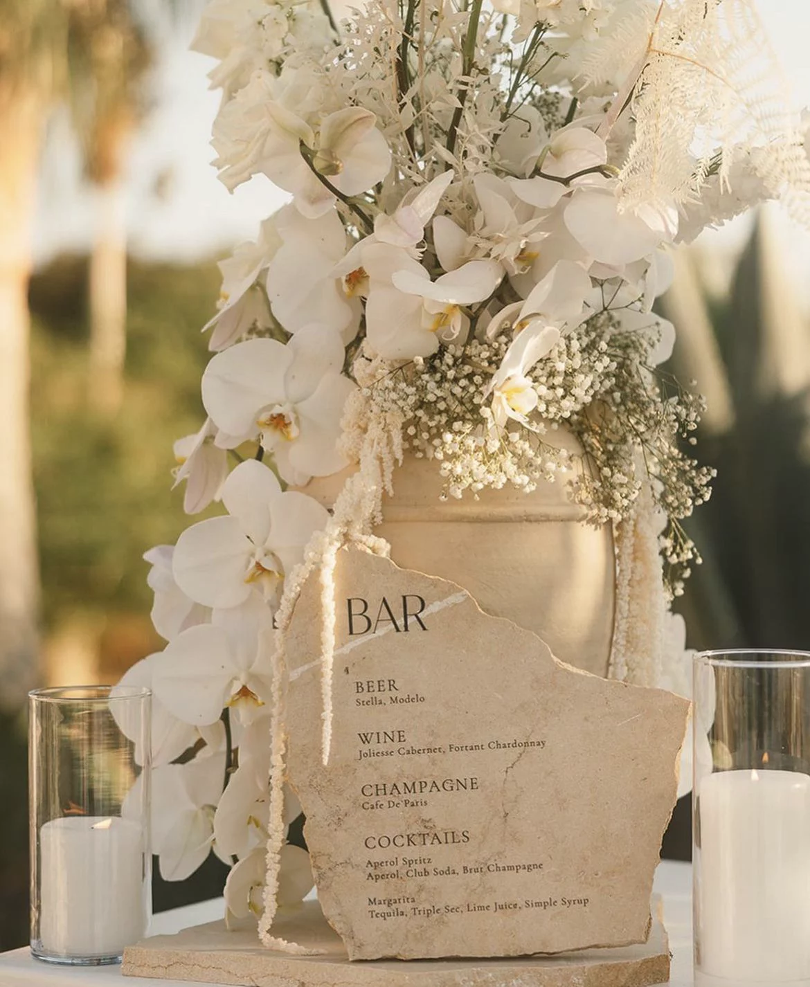 White orchid bar urn arrangement